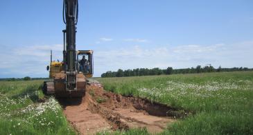 Opening a new pit at the Arnheim farm of Upper Peninsula, MI, in the search of more wood.   